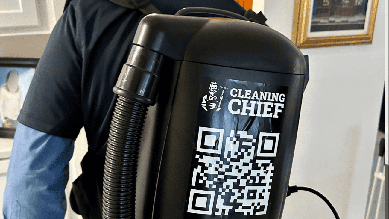 Cleaner vacuuming with professional HEPA Shop-vac for after renovation cleaning project in Brooklyn