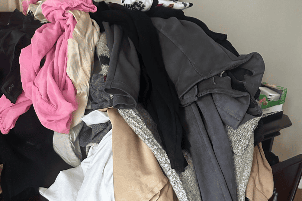 Clothes laundry pile, messy laundry with various garments, laundry cleaning service, clutter cleanup, deep cleaning.