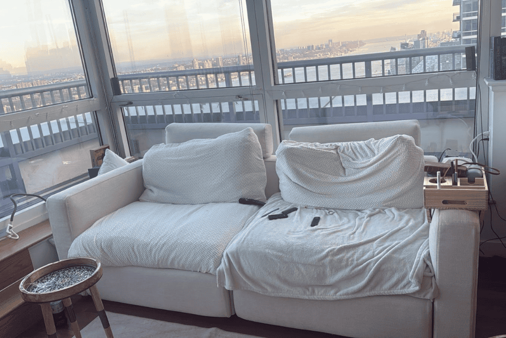 Cluttered messy living room before professional cleaning and organizing service