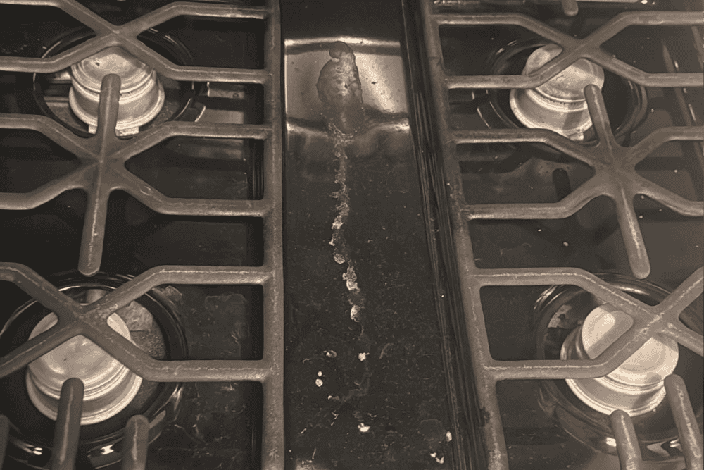 Rusty stove burners and dirty cooktop, professional cleaning by Cleaning Chief NYC.